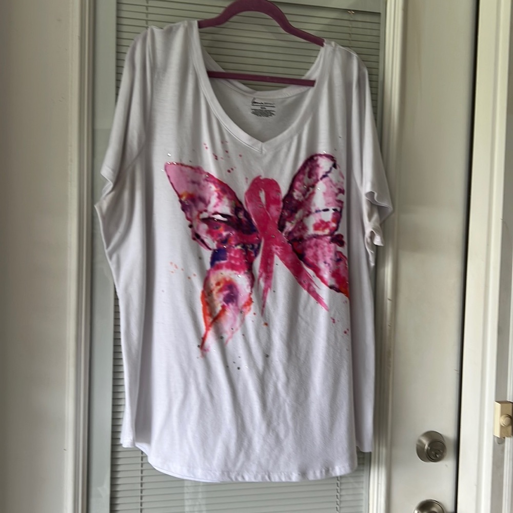 White knit top with breast cancer butterfly.